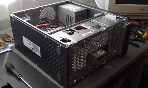 This is a picture of a custom built tower computer case having a new corsair power suplly unit fitted to replace the old power supply pc at a pc repair shop in stevenage near hitchin letchworth baldock welwyn garden city hatfield hertford knebworth north herts