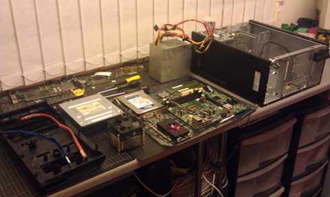 This is a picture showing the inside parts of a computer sitting on a workbench in a computer repair workshop in stevenage high street hertfodshire near hitchin letchworth baldock welwyn garden city hatfield hertford knebworth north herts